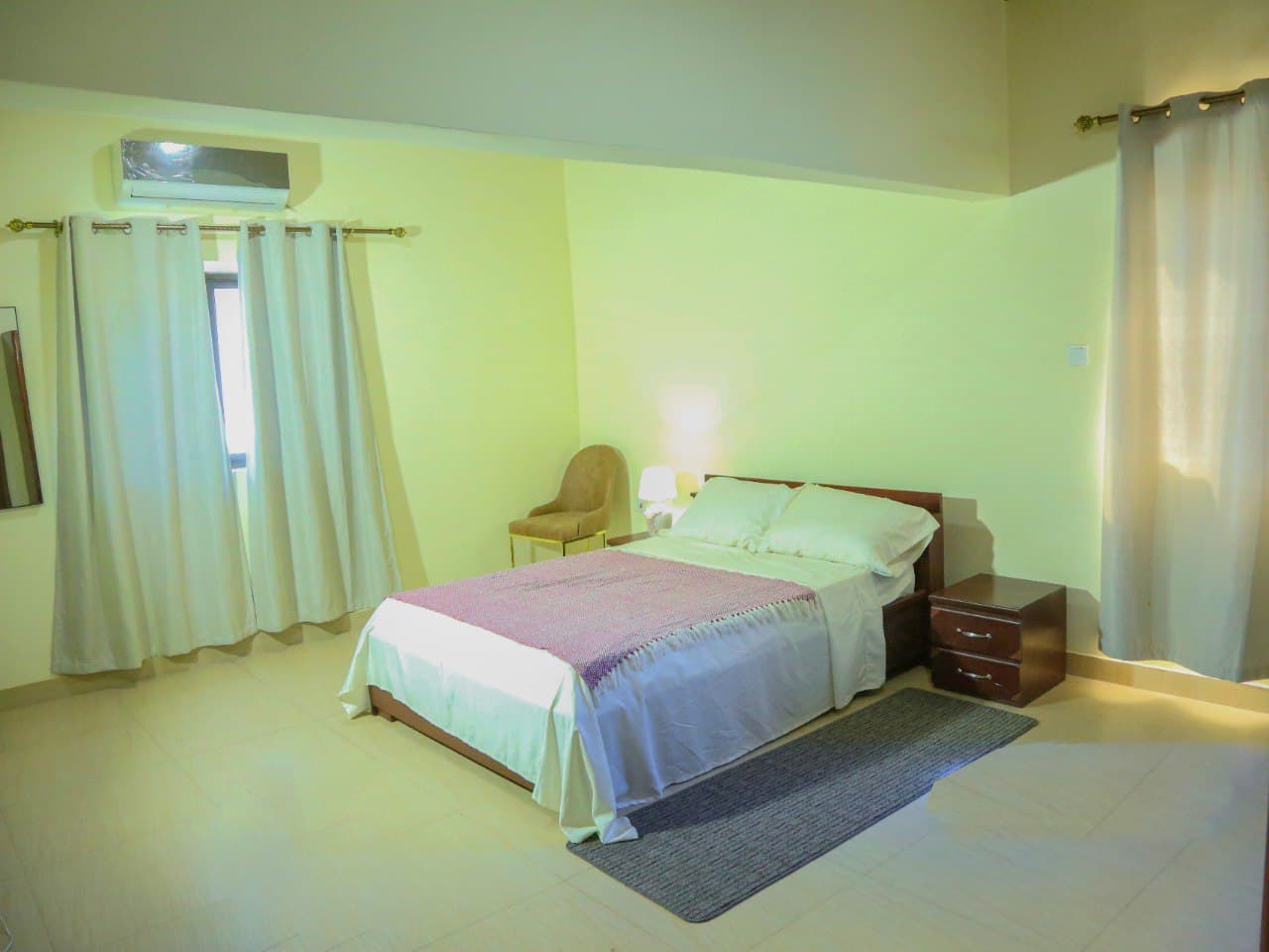 Queen bedroom with warm lamplight